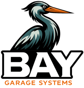 Bay Garage Systems logo: stylized pelican perched above bold white BAY letters with orange GARAGE SYSTEMS below.
